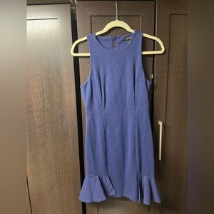 Sleeveless dress with ruffled detail.